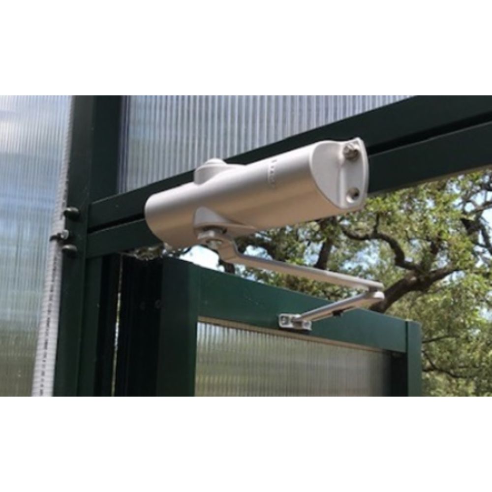 Security camera mounted on a metal frame with trees in the background