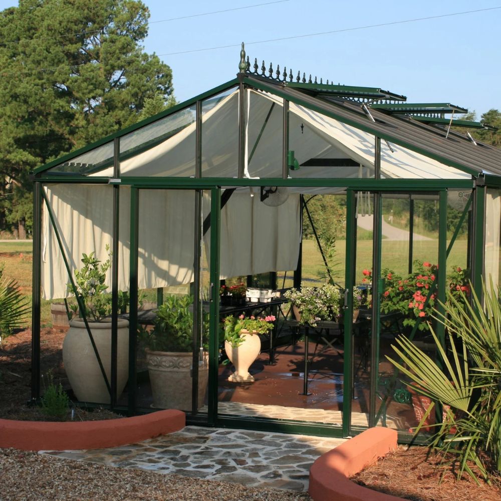 Greenhouse with plants and outdoor furniture on a sunny day