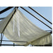 White canopy tent with ropes against a clear blue sky
